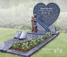 Grafmonument met hart en beeldje