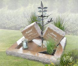 Kort grafmonument met bronzen boom