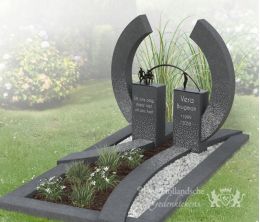 Modern granieten grafmonument met brons