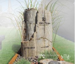 Natuurlijk grafmonument met bronzen accessoires