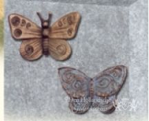 Bronzen vlinders op grafsteen foto 3