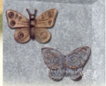 Bronzen vlinders op grafsteen foto 3