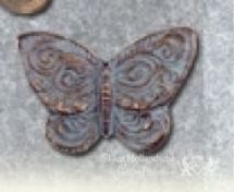 Bronzen vlinders op grafsteen foto 4
