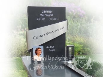 Eigentijds grafmonument van natuursteen en rvs