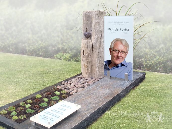 Modern glazen grafmonument met ruwe steensoorten foto 1